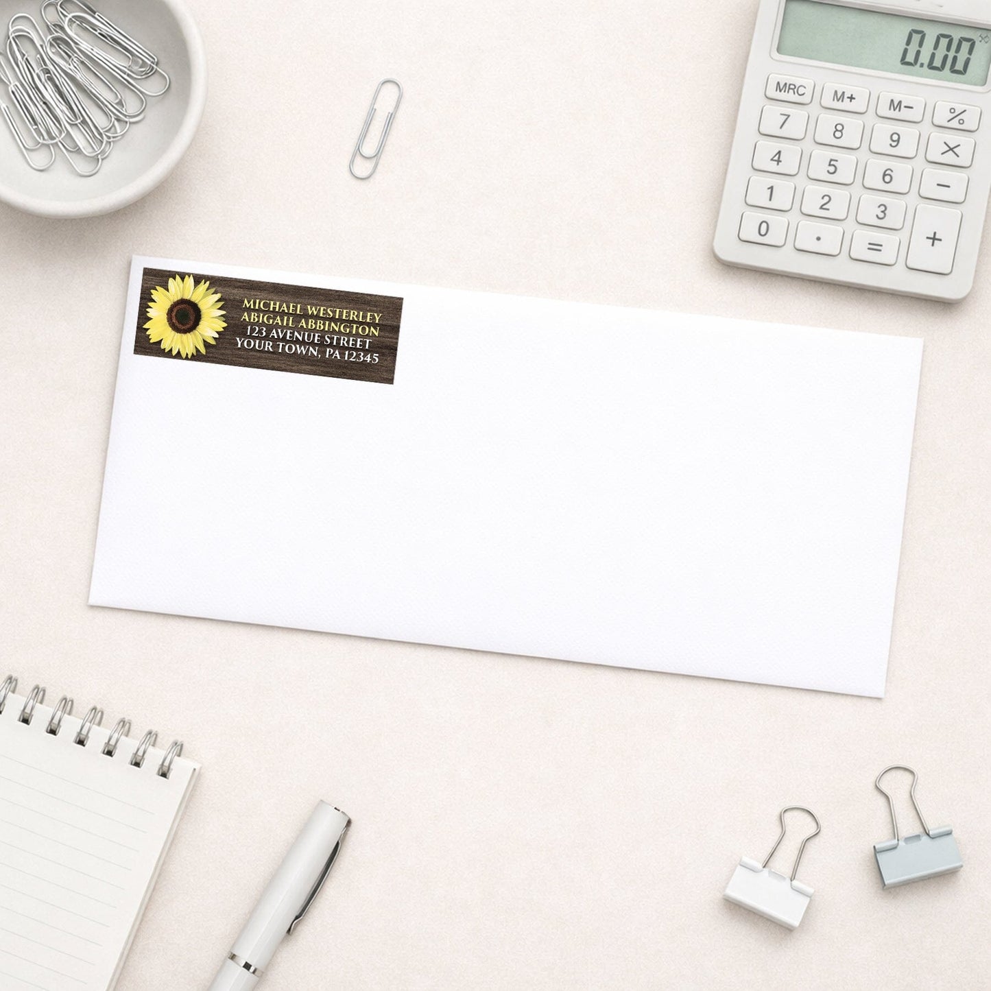 Rustic Sunflower Brown Wood Address Label shown on a white envelope with everyday office supplies