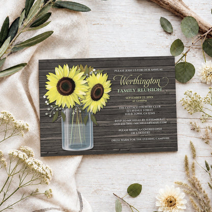 Rustic Sunflower Wood Mason Jar Family Reunion Invitation on a wooden surface with spring and summer plants.