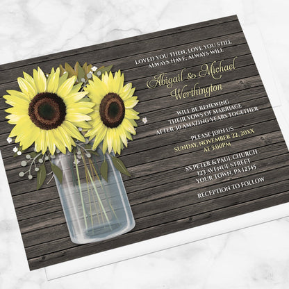 Rustic Sunflower Wood Mason Jar Vow Renewal Invitation shown at an angle on a marble surface with a white envelope.