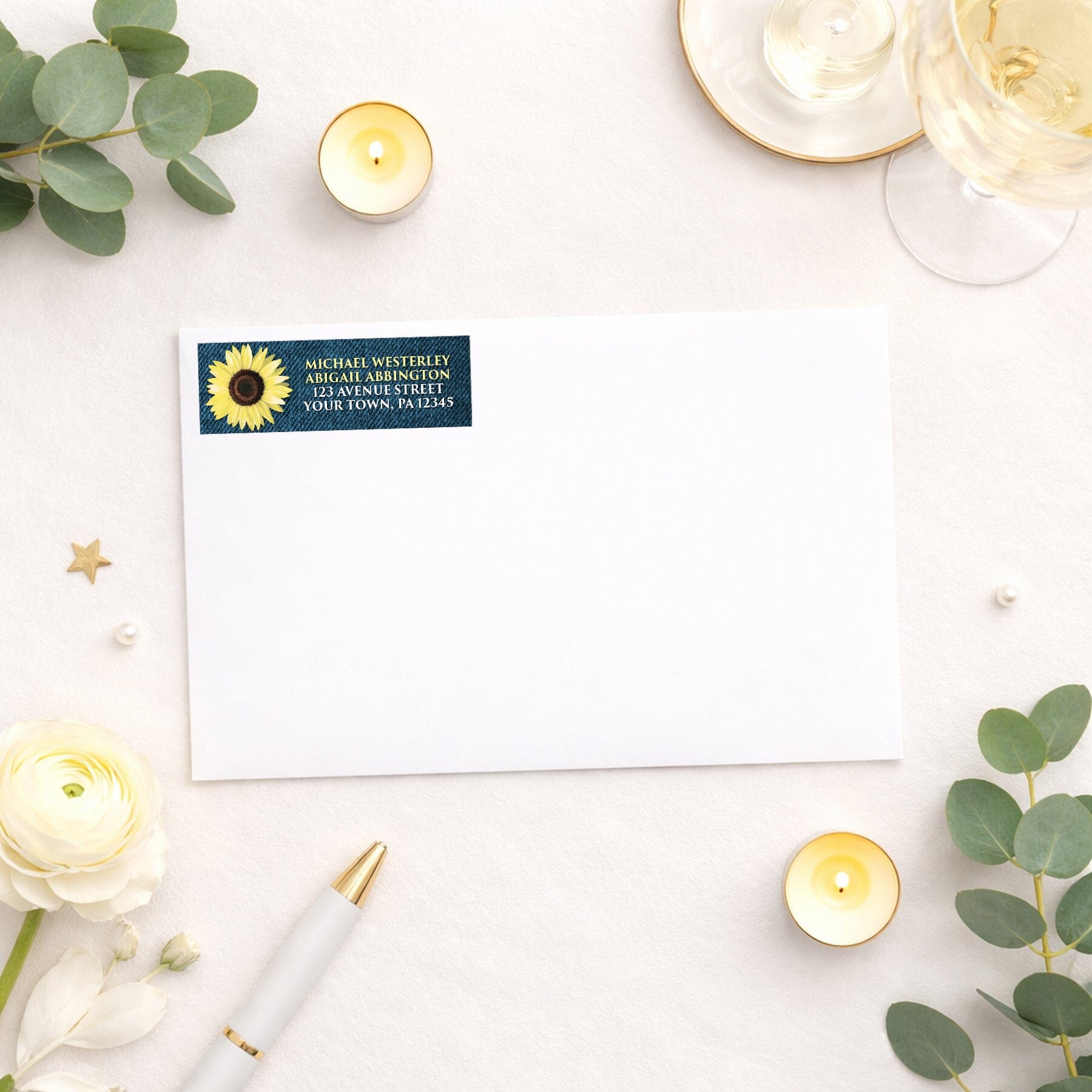 Rustic Sunflower and Denim Address Label shown on a white envelope with wedding and shower supplies
