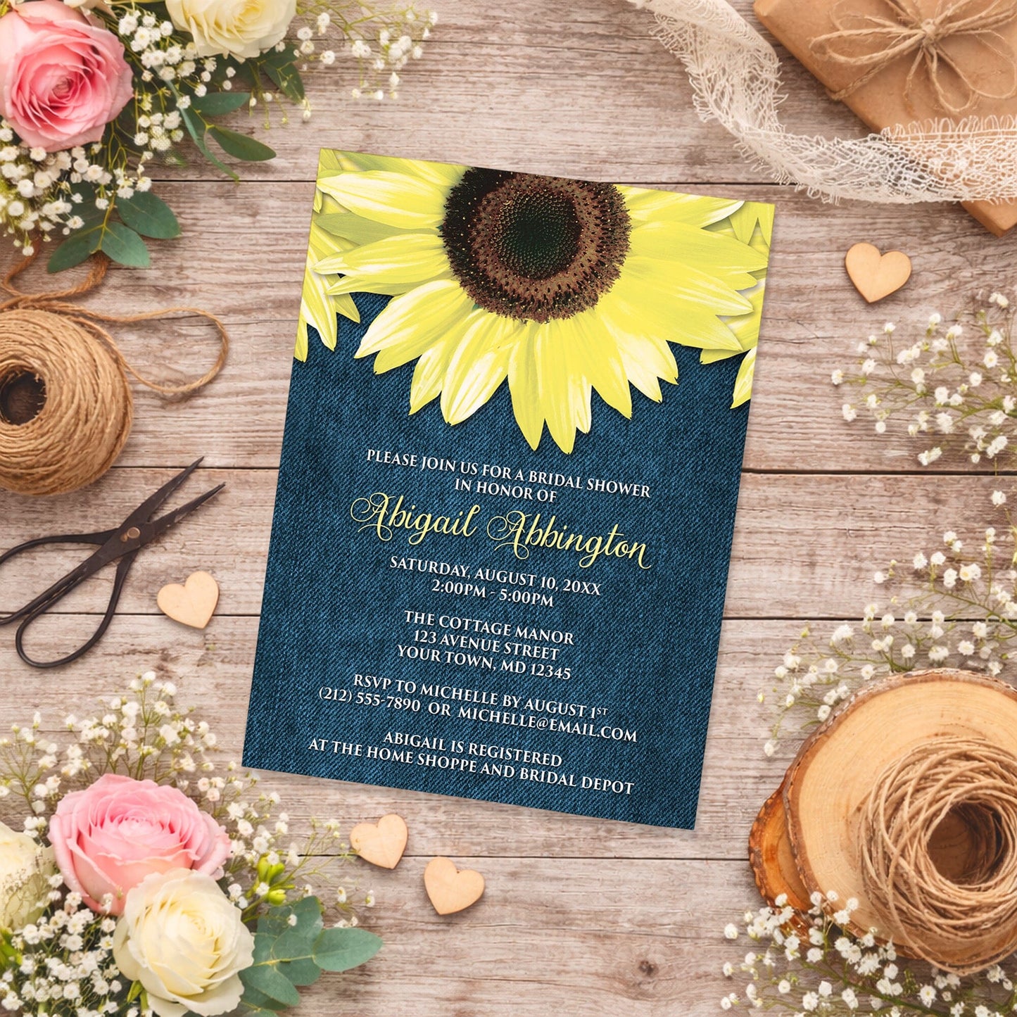 Rustic Sunflower and Denim Bridal Shower Invitation on a wooden surface with flowers and twine.