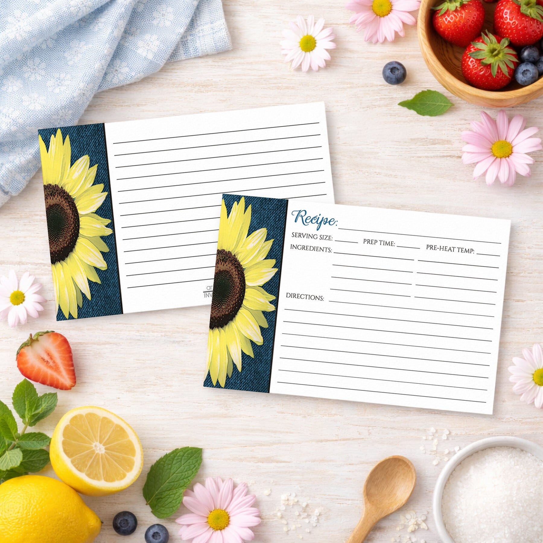 Two Rustic Sunflower and Denim Recipe Cards on a wooden surface with spring and summer fruits and flowers.