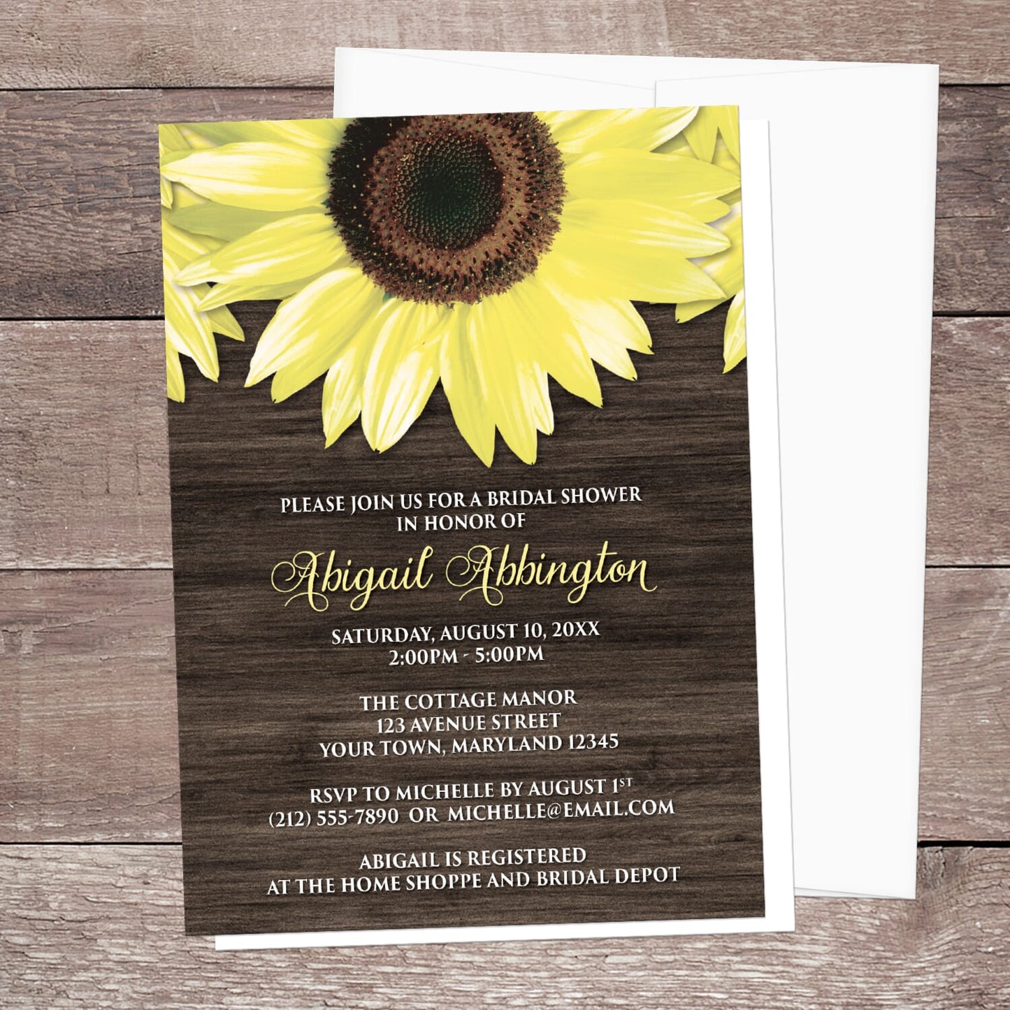 Sunflower-themed bridal shower invitation with a white envelope on a wooden surface