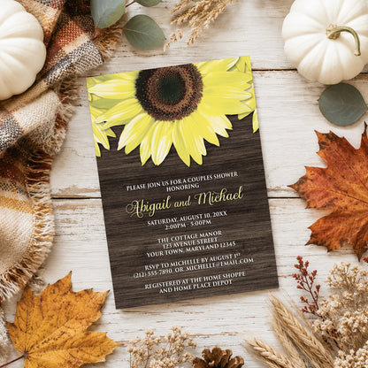 Rustic Sunflower and Wood Couples Shower Invitation shown on a light wooden surface with fall leaves and autumn decor.