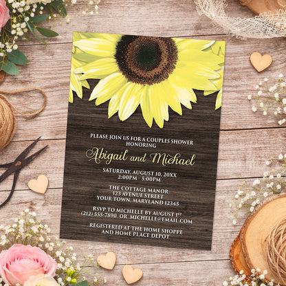Rustic Sunflower and Wood Couples Shower Invitation shown on a wooden surface with spring and summer flowers, small wood hearts, lace, and twine.