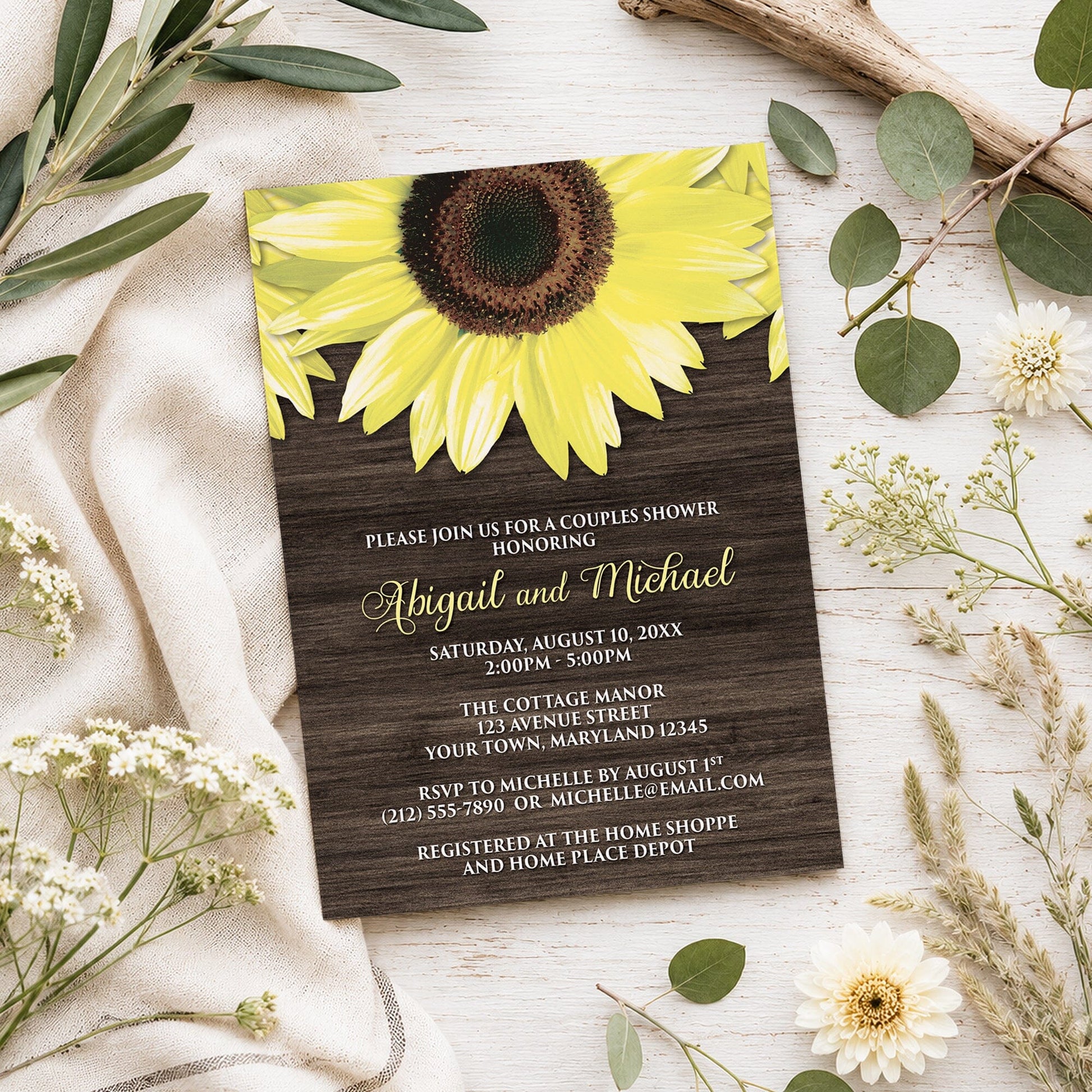 Rustic Sunflower and Wood Couples Shower Invitation shown on a light wooden surface with spring and summer plants.