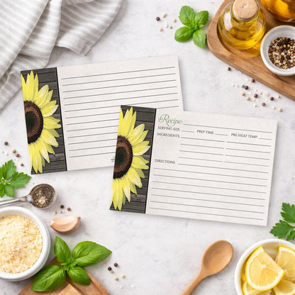 Two Rustic Sunflower and Wood Recipe Cards on a kitchen counter with ingredients and utensils.