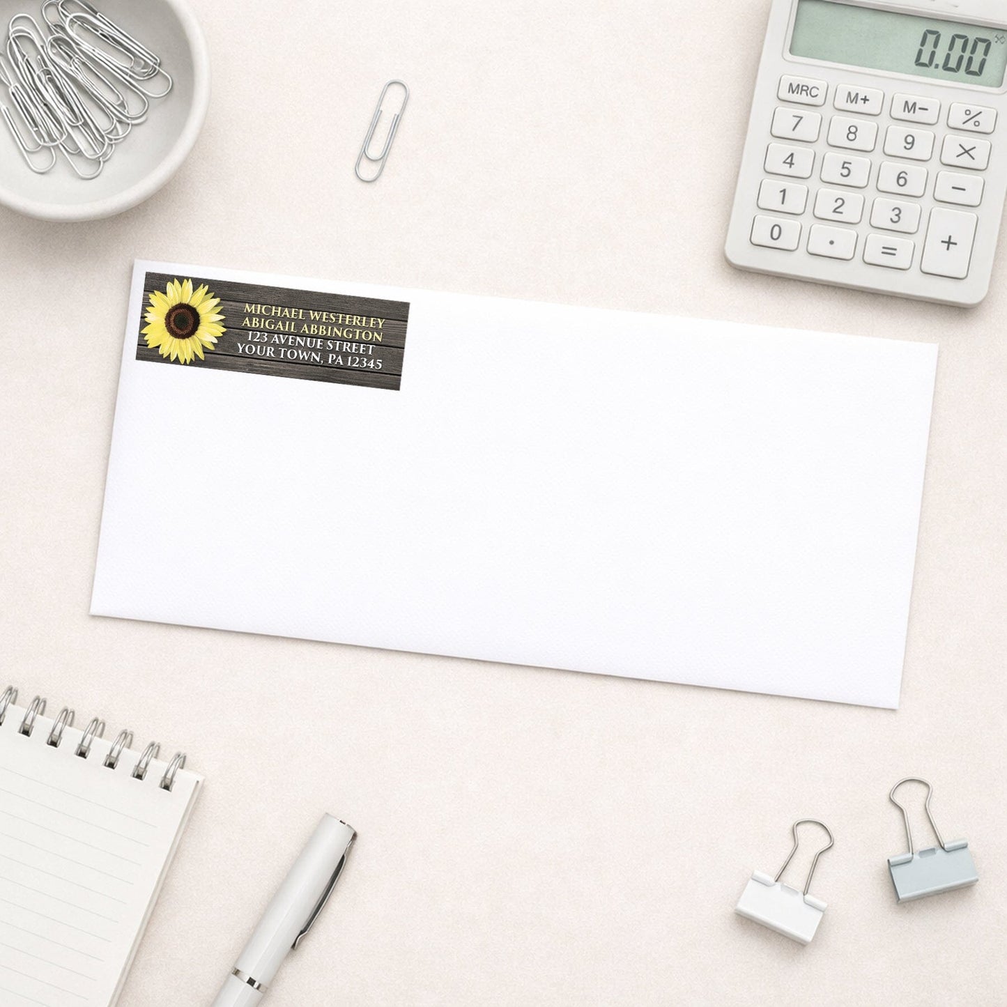 Rustic Sunflower on Wood Address Label shown on a white envelope with office supplies