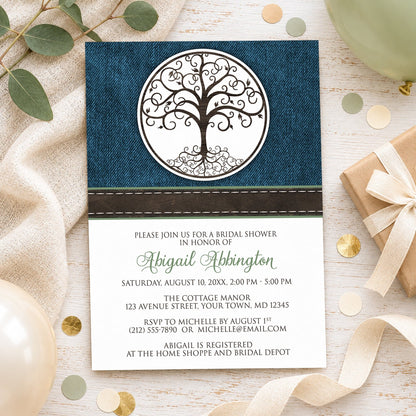 Rustic Tree of Life bridal shower invitation with brown decorative tree-of-life design, blue denim background, brown stitched ribbon, and green personalized name, styled in a flat-lay arrangement with balloons, leaves, and a wrapped gift in neutral colors.