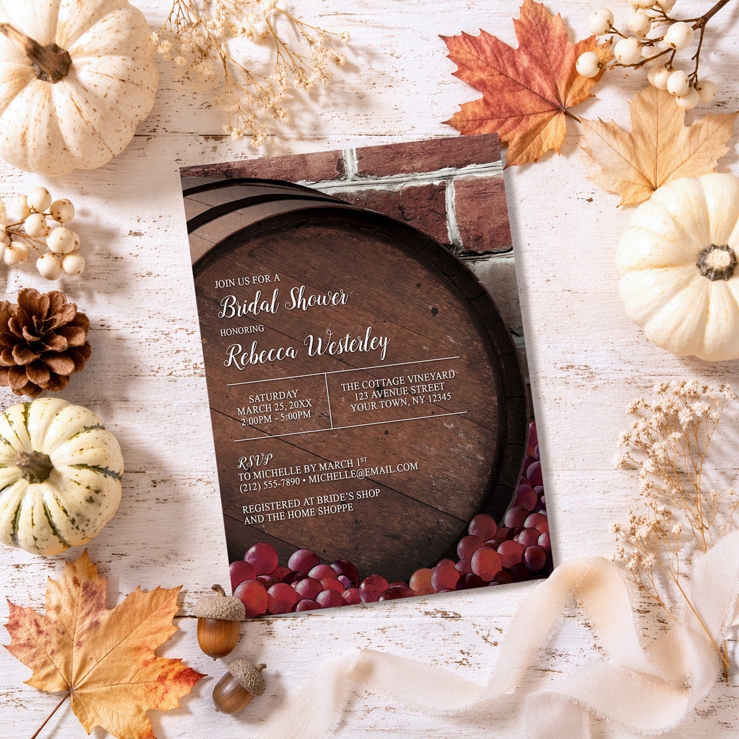 Rustic Wine Barrel Vineyard Bridal Shower Invitation on a wooden surface with autumn decorations