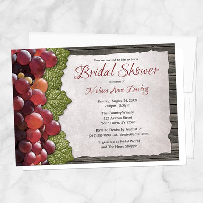 Rustic Winery Grapes and Wood Bridal Shower Invitation shown on a marble surface with a white envelope.