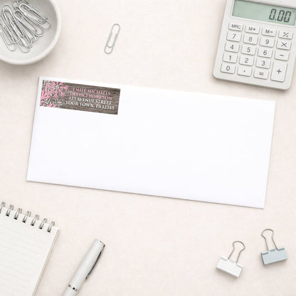 Rustic Winter Wood Pink Snowflake Address Label shown on a white envelope with everyday office supplies