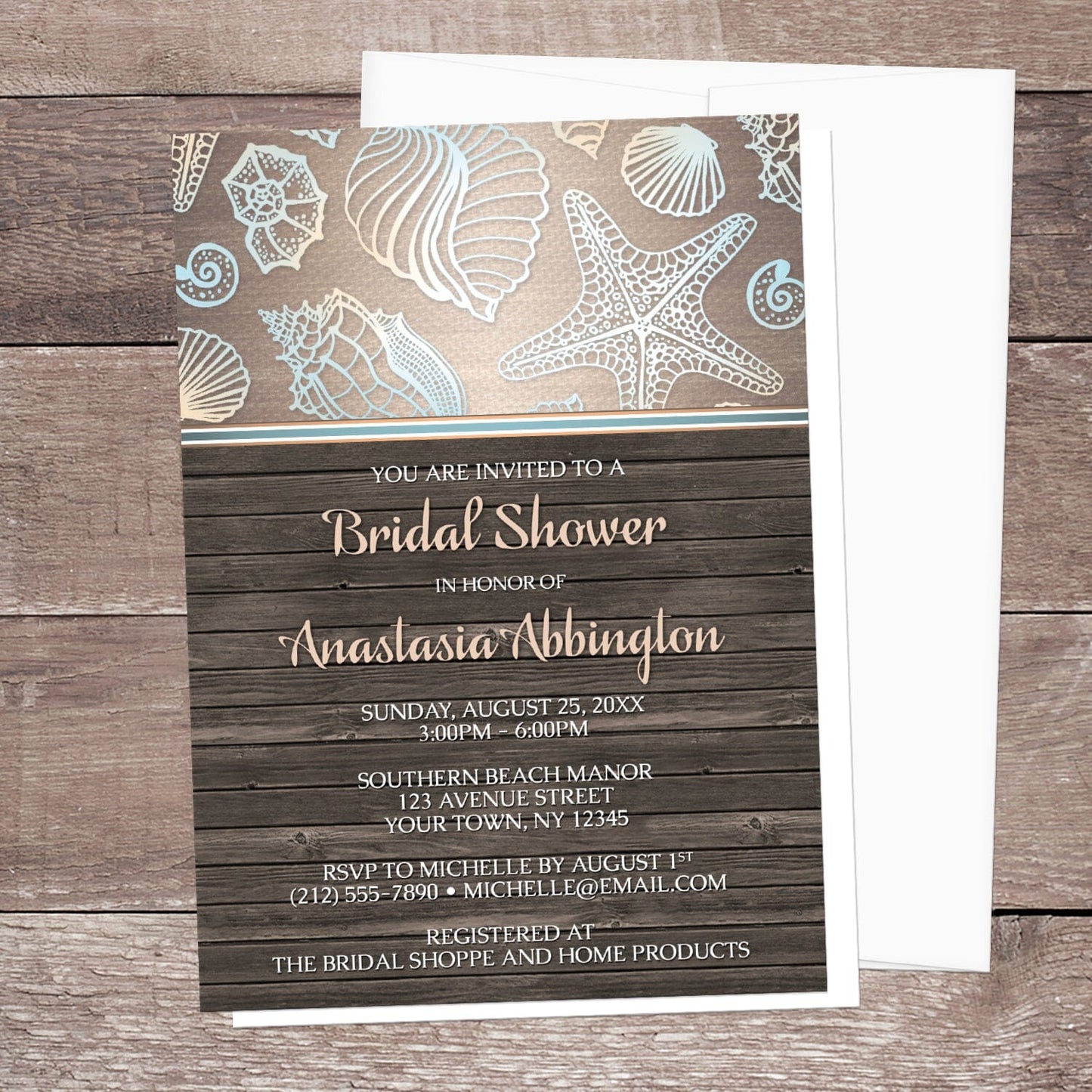 Rustic Wood Beach Seashell Bridal Shower Invitation shown on a wooden surface with a white envelope.