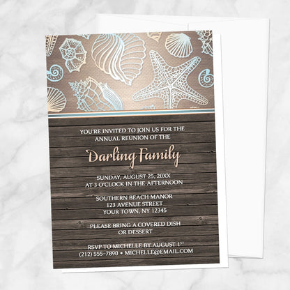 Rustic Wood Beach Seashell Family Reunion Invitation shown on a marble surface with a white envelope.