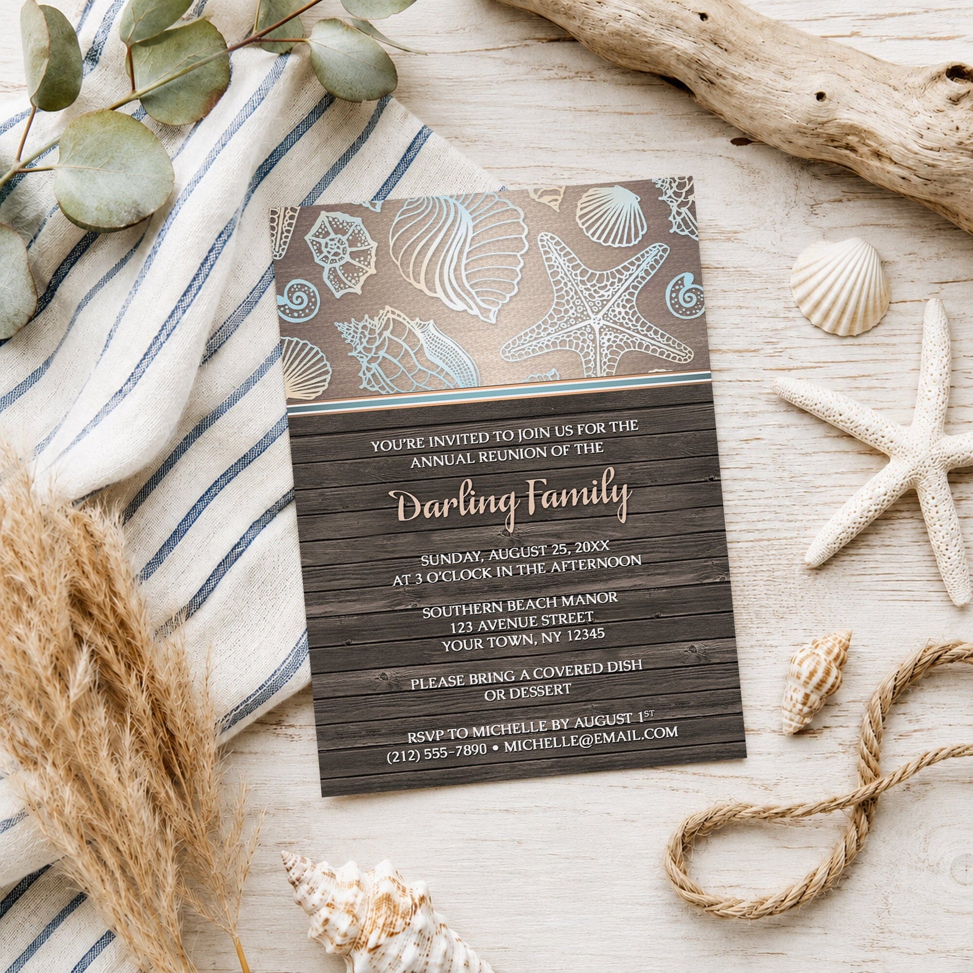 Rustic Wood Beach Seashell Family Reunion Invitation shown on a wooden surface with beach and coastal decor.