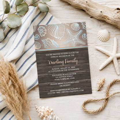 Rustic Wood Beach Seashell Family Reunion Invitation shown on a wooden surface with beach and coastal decor.