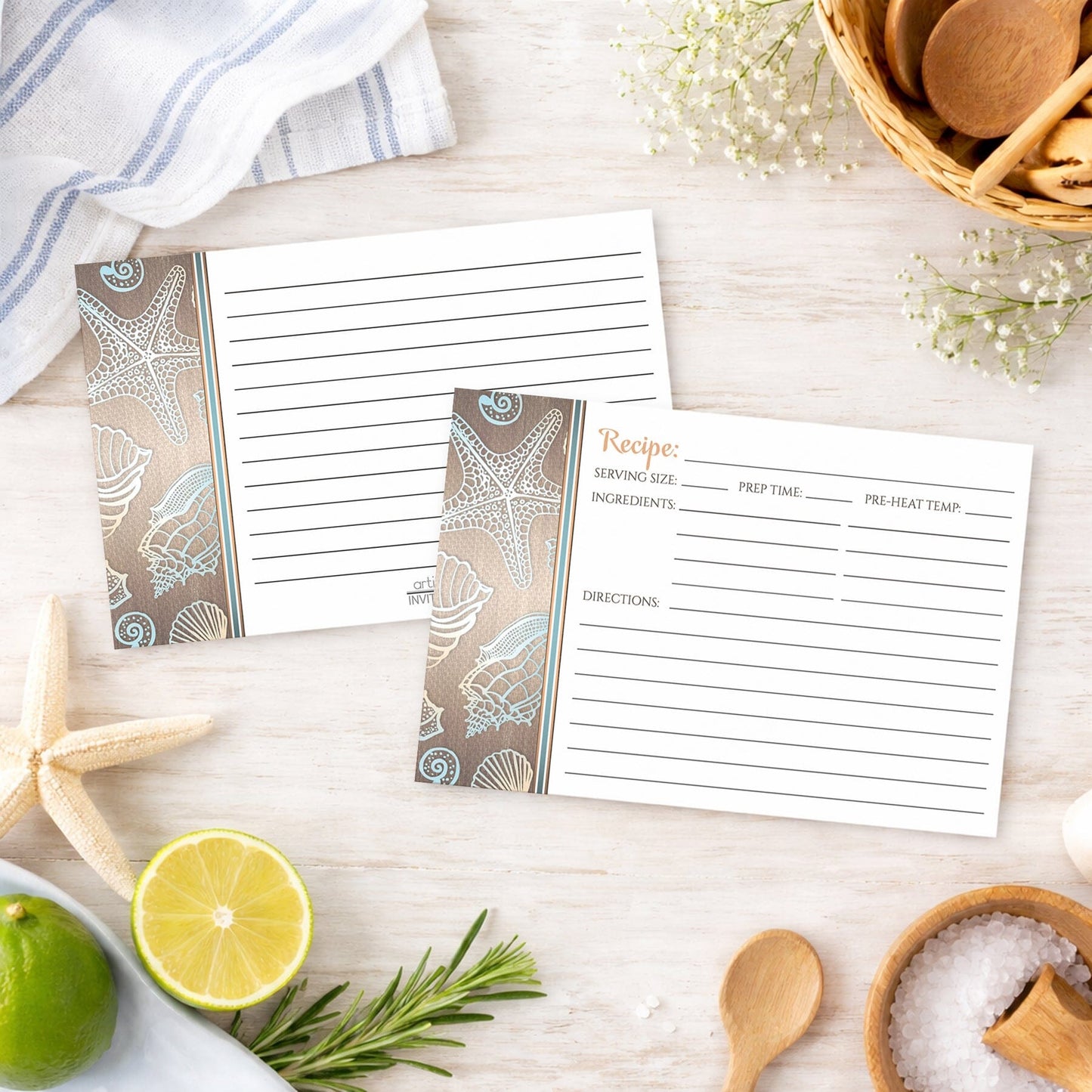 Set of Rustic Wood Beach Seashell Recipe Cards with coastal design on a wooden surface in a beach house with kitchen items.