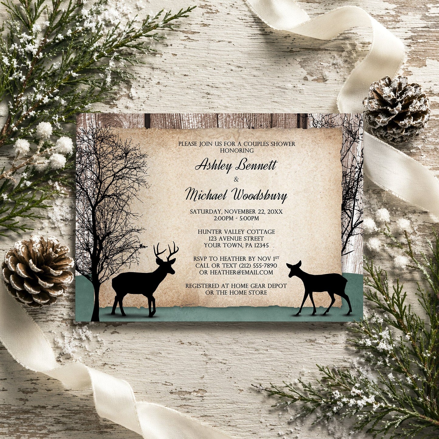 Rustic Woodsy Deer Couples Shower Invitation shown on a rustic wooden surface with winter greenery, ribbons, and pine cones.