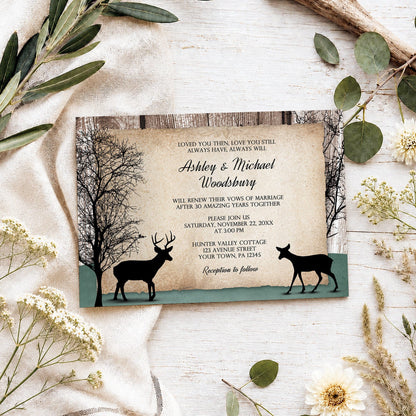 Rustic Woodsy Deer Vow Renewal Invitation shown on a light wooden surface with spring and summer plants.