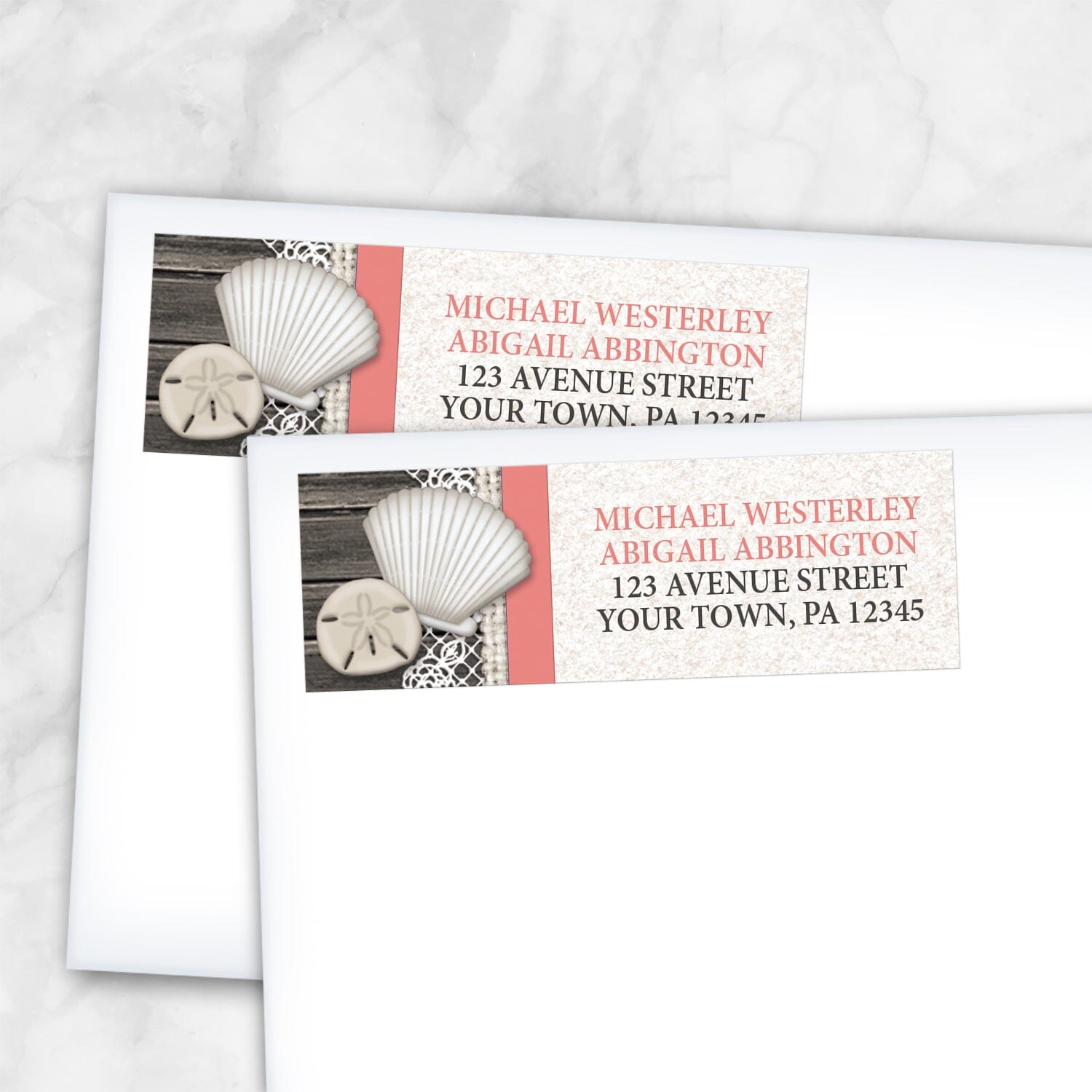 2 Seashell Lace Wood and Sand Coral Beach Address Labels shown on white envelopes on a marble surface