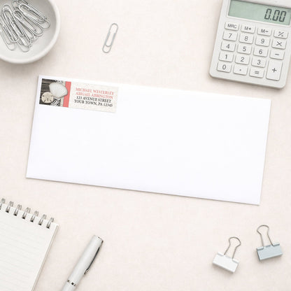 Seashell Lace Wood and Sand Coral Beach Address Label shown on a white envelope with everyday office supplies