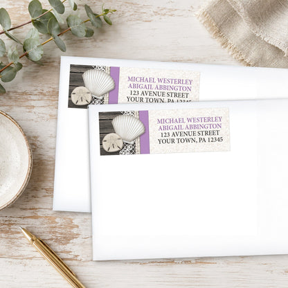 Seashell Lace Wood and Sand Purple Beach Address Labels shown on white envelopes, on a wooden surface with plants and a pen.