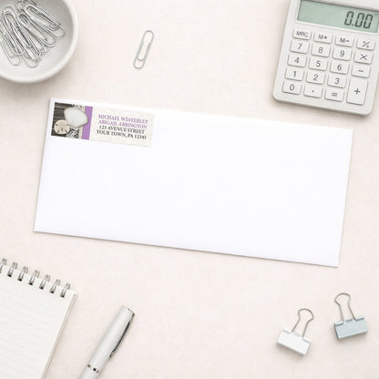 Seashell Lace Wood and Sand Purple Beach Address Label shown on a white envelope with everyday office supplies