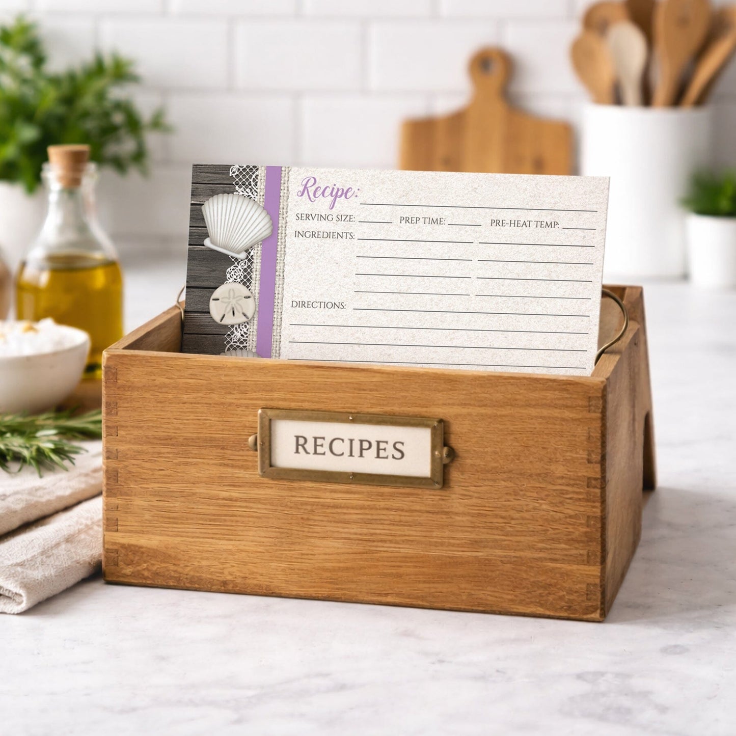 Wooden recipe box with a Seashell Lace Wood and Sand Purple Beach Recipe Card on a kitchen counter
