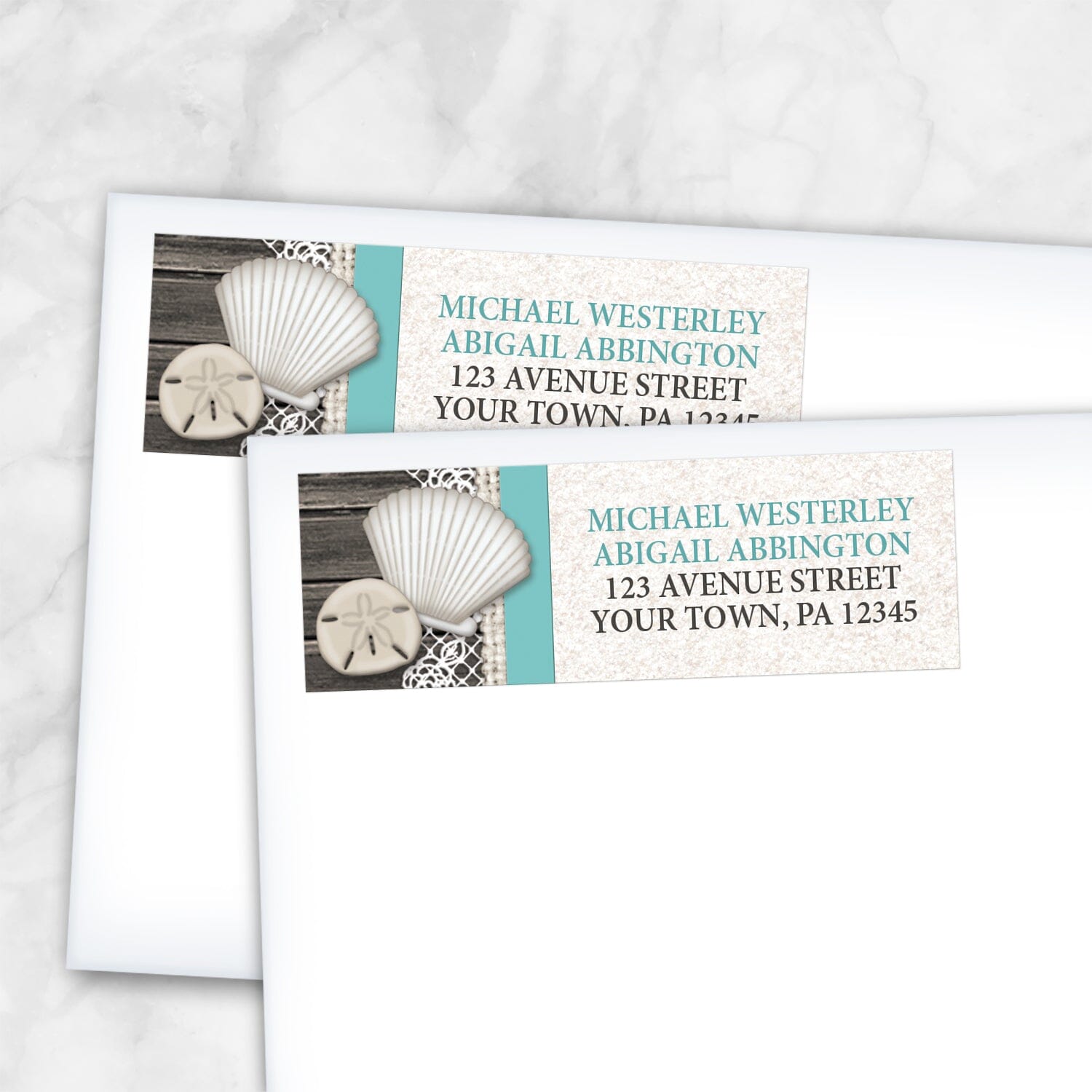 2 Seashell Lace Wood and Sand Teal Beach Address Labels shown on white envelopes on a marble surface