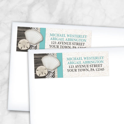 2 Seashell Lace Wood and Sand Teal Beach Address Labels shown on white envelopes on a marble surface