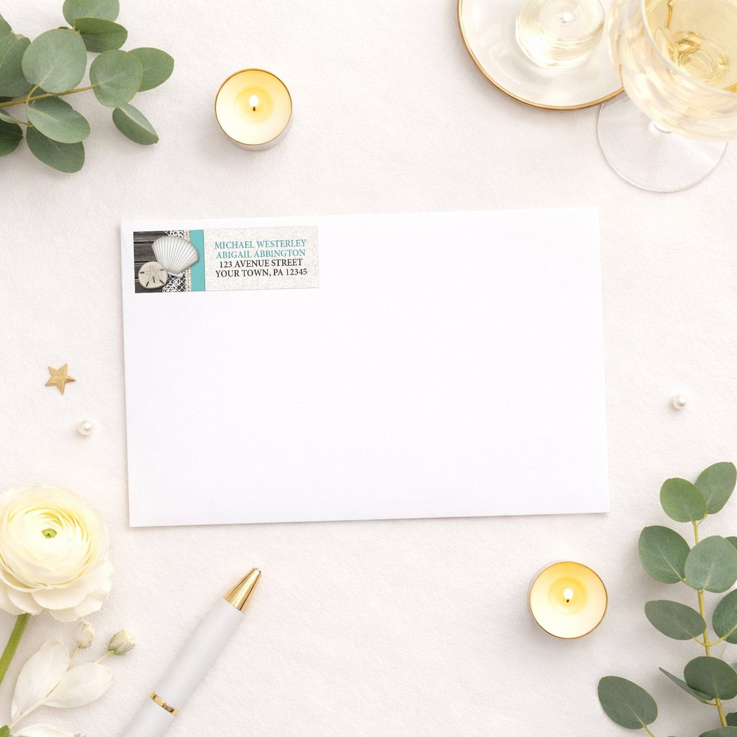 Seashell Lace Wood and Sand Teal Beach Address Label shown on a white envelope with wedding and shower supplies