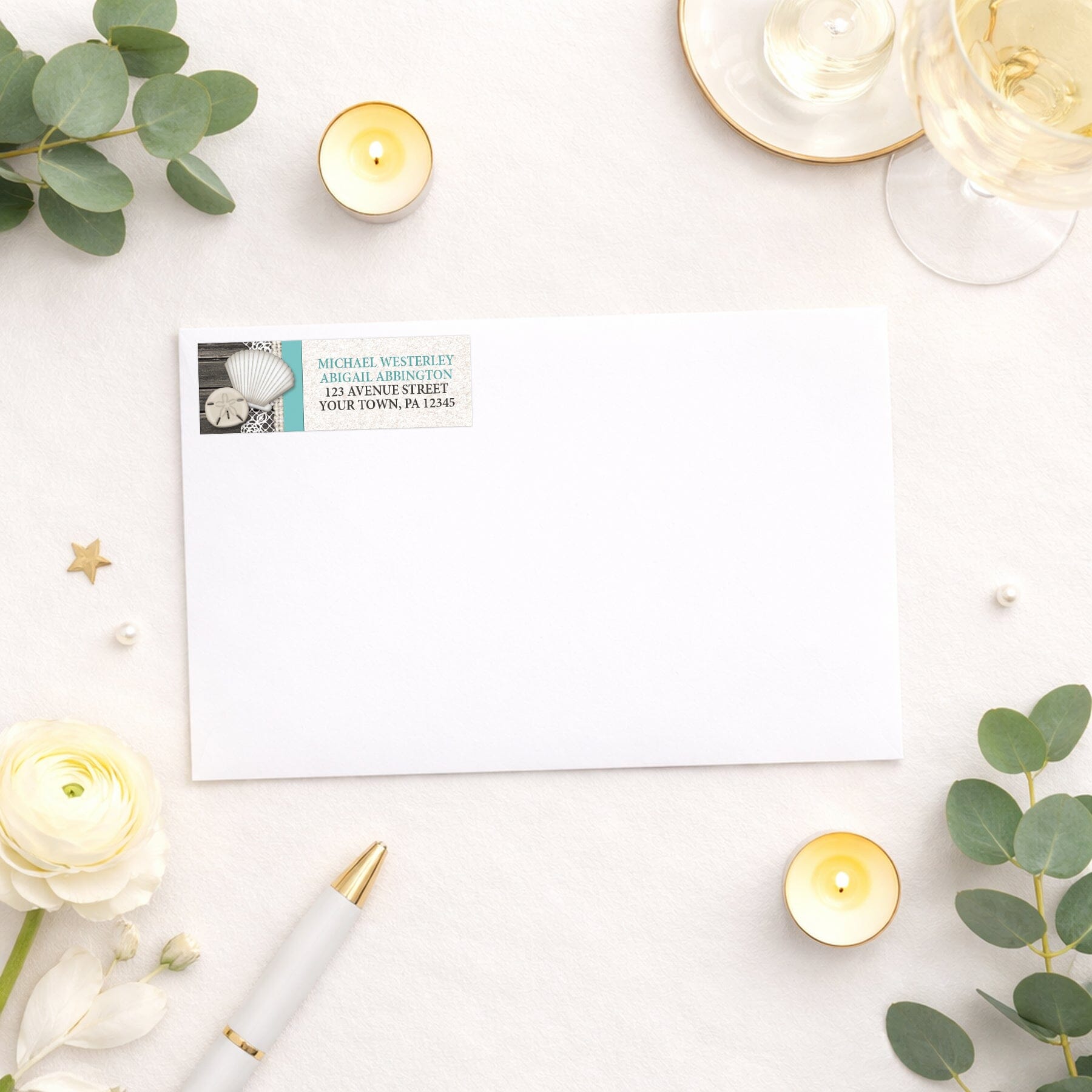 Seashell Lace Wood and Sand Teal Beach Address Label shown on a white envelope with wedding and shower supplies