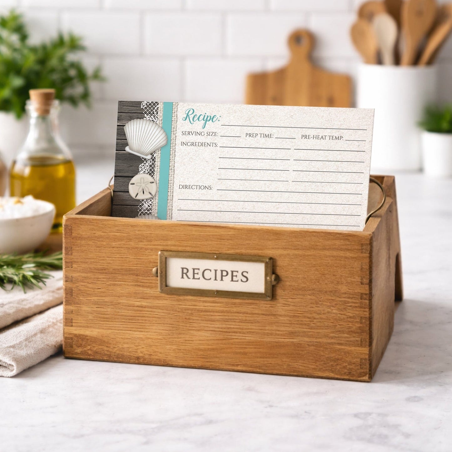 Wooden recipe box with a Seashell Lace Wood and Sand Teal Beach Recipe Card on a kitchen counter