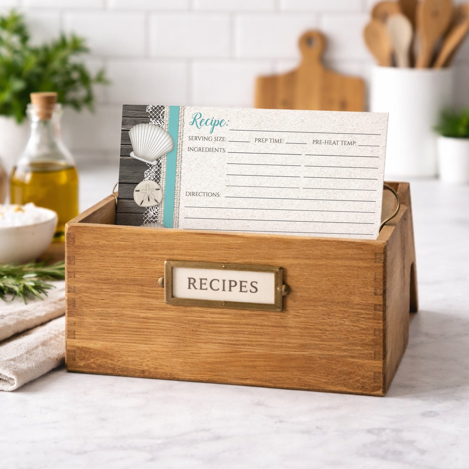Wooden recipe box with a Seashell Lace Wood and Sand Teal Beach Recipe Card on a kitchen counter
