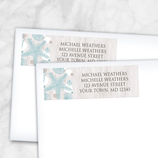 2 Seashell Whitewashed Wood Beach Address Labels shown on white envelopes on a marble surface