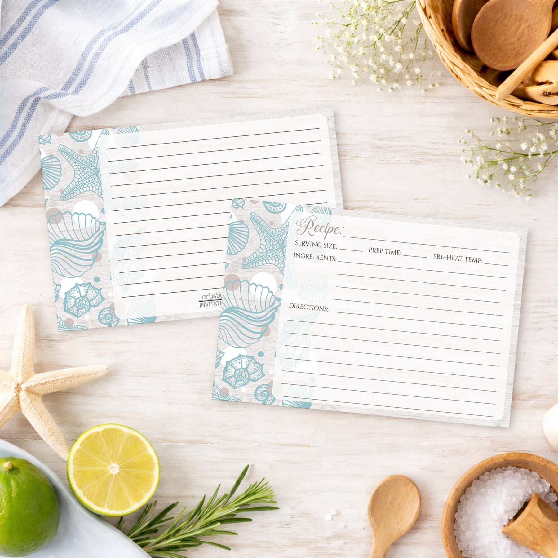 Set of Seashell Whitewashed Wood Beach Recipe Cards on a beach house wooden surface with kitchen items.