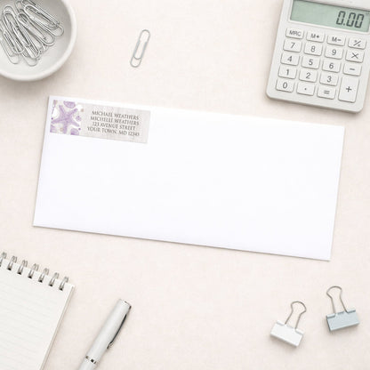Seashell Whitewashed Wood Purple Beach Address Label shown on a white envelope with office supplies