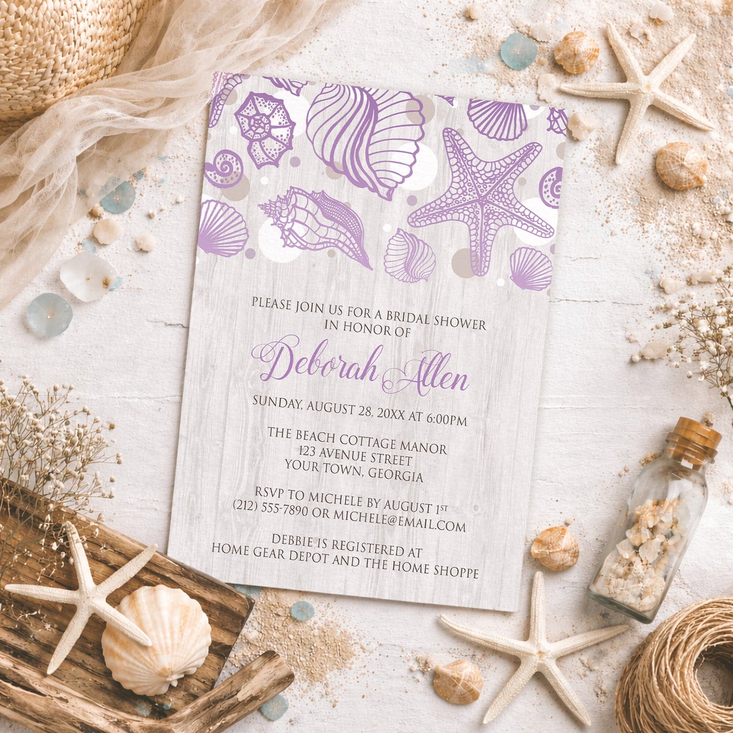 Seashell Whitewashed Wood Purple Beach Bridal Shower Invitation on a beach-themed surface with coastal decor.