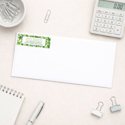 Shamrocks and 4-Leaf Clovers Address Label shown on a white envelope with office supplies