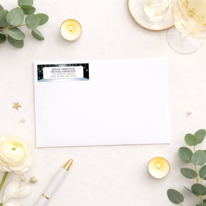 Snowy Winter Road Tree Lights Address Label shown on a white envelope with wedding supplies