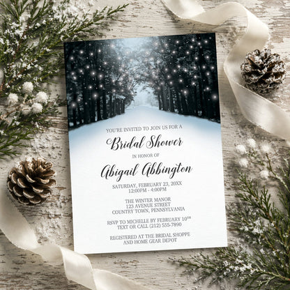 Winter-themed bridal shower invitation with snowy forest design on a rustic wooden surface with decorative elements.