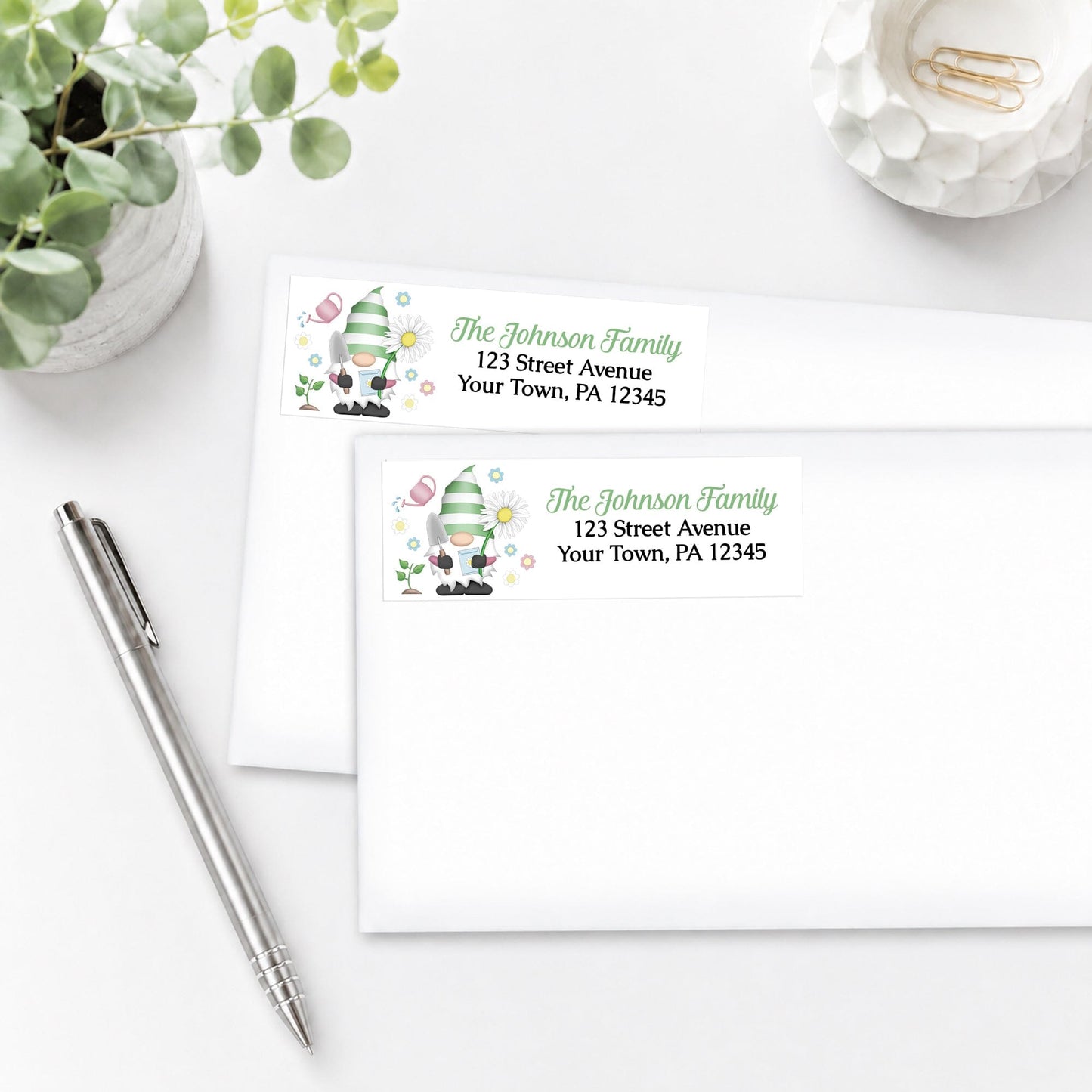 Spring Gardening Gnome Address Labels on white envelopes, shown on a white surface with a pen and plant.