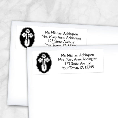 St. Olga Cross Orthodox Address Labels at Artistically Invited. These elegant address labels are designed with a beautiful St. Olga Cross design on the left with your personalized return address custom printed in black to the right over white. Image shows 2 address labels on envelopes.