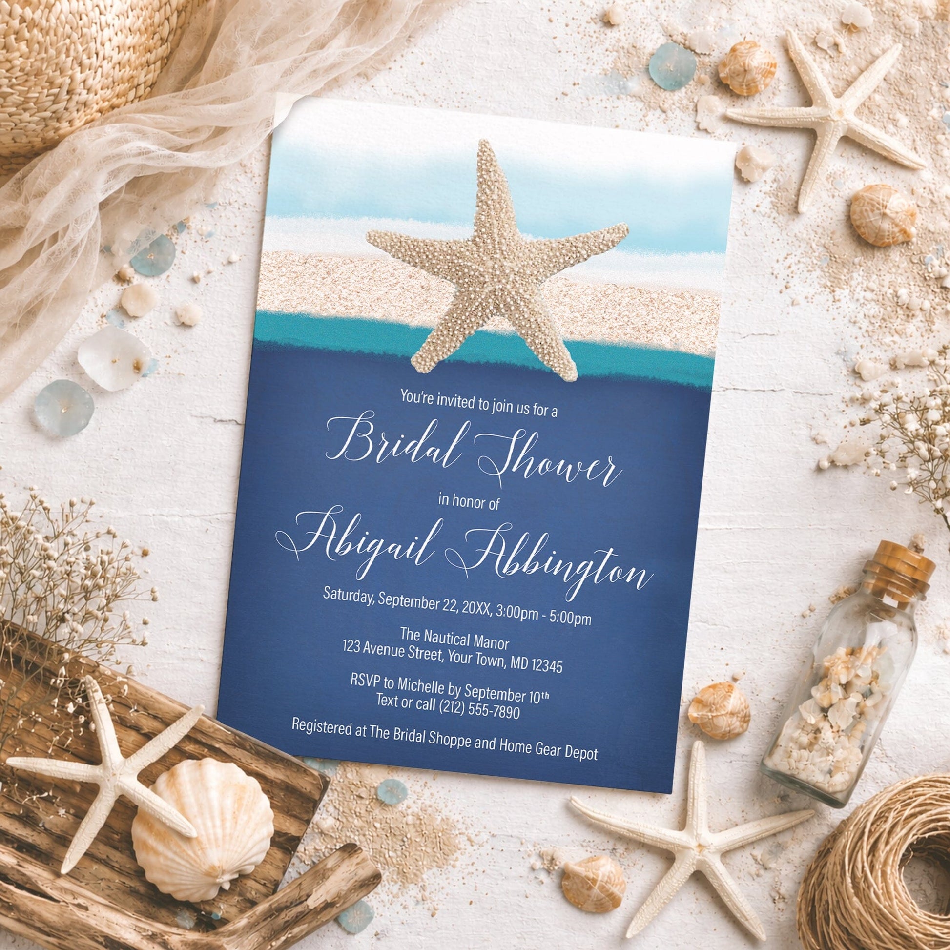Starfish Navy Blue Teal Beach Bridal Shower Invitation with starfish and shells on a sandy background