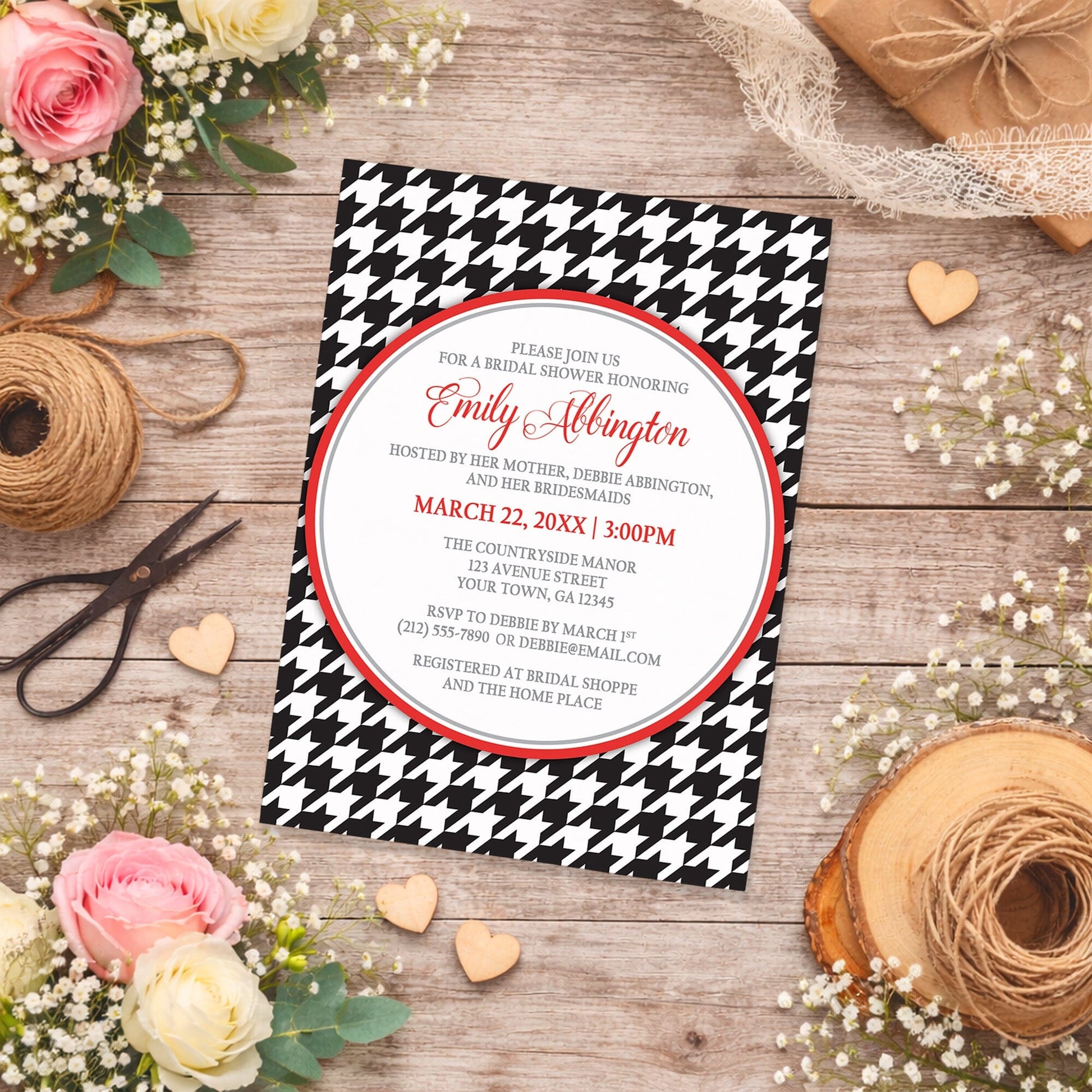 Stylish Black Houndstooth Red Bridal Shower Invitation shown on a country-inspired wooden surface with spring and summer flowers, small wood hearts, and twine.