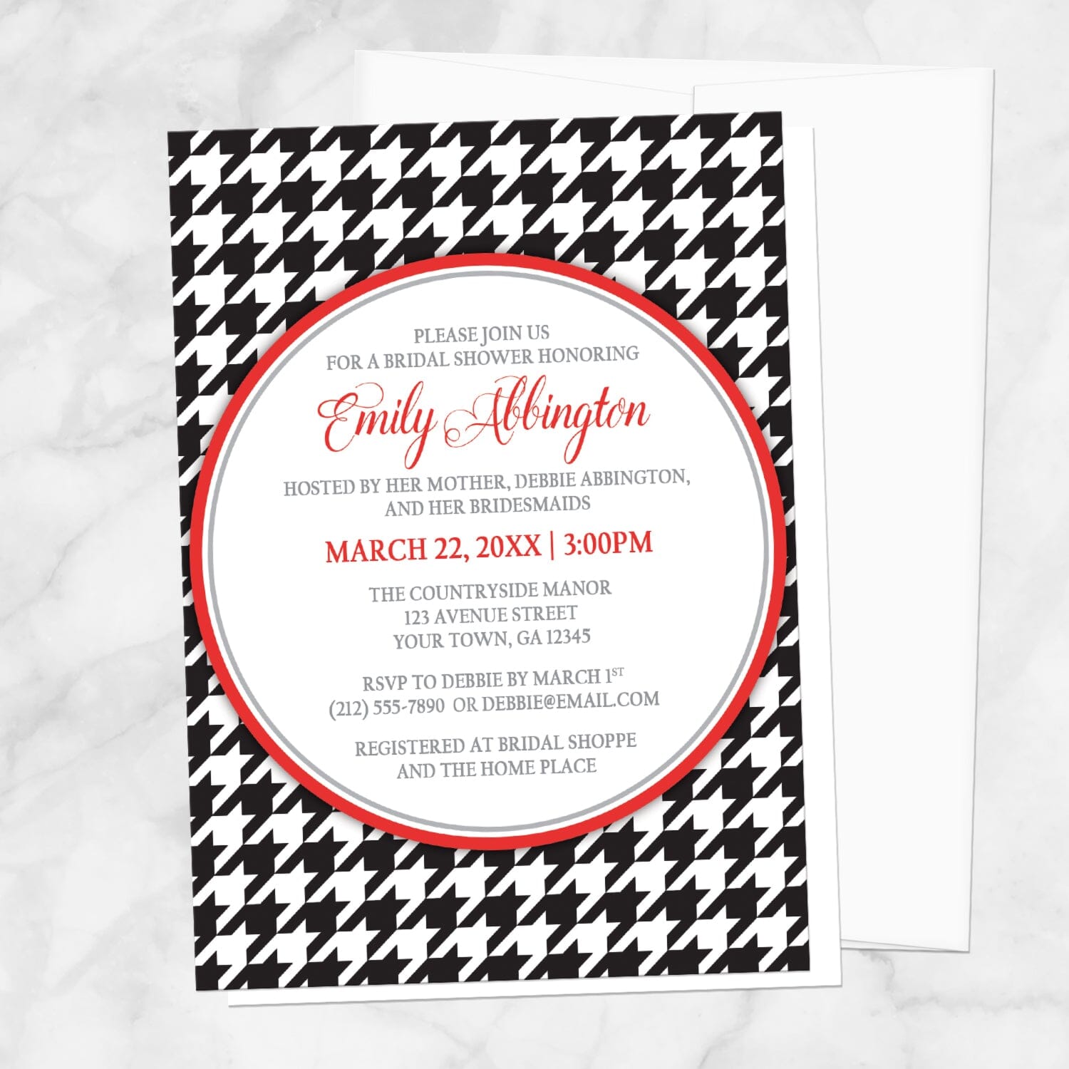 Stylish Black Houndstooth Red Bridal Shower Invitation shown on a marble surface with a white envelope.