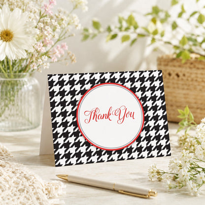 Stylish Black Houndstooth Red Thank You Card shown on a tabletop with a vase, spring and summer flowers, and a pen.