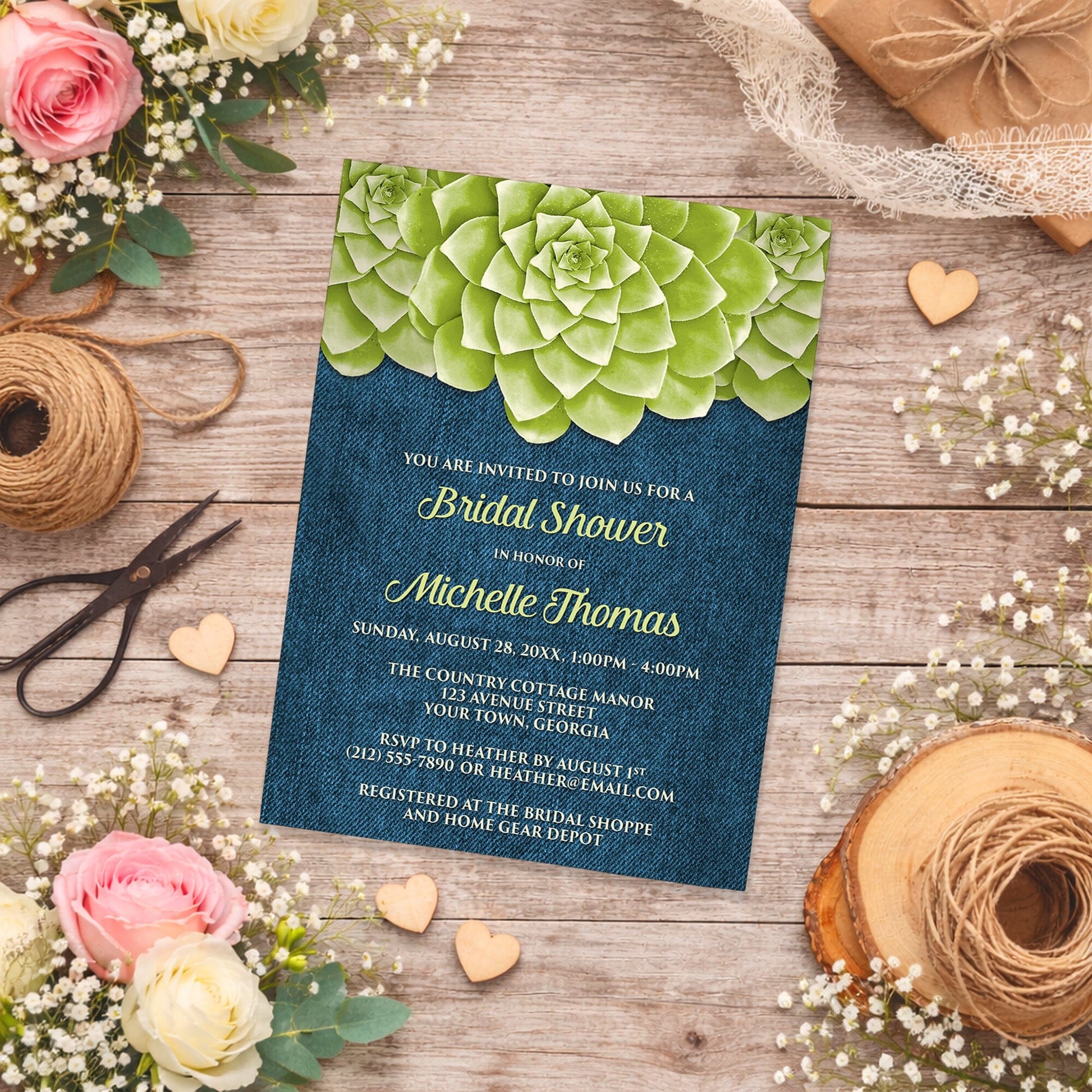 Succulent Green Blue Denim Bridal Shower Invitation shown on a country-inspired wooden background with spring and summer flowers, small wood hearts, and twine.