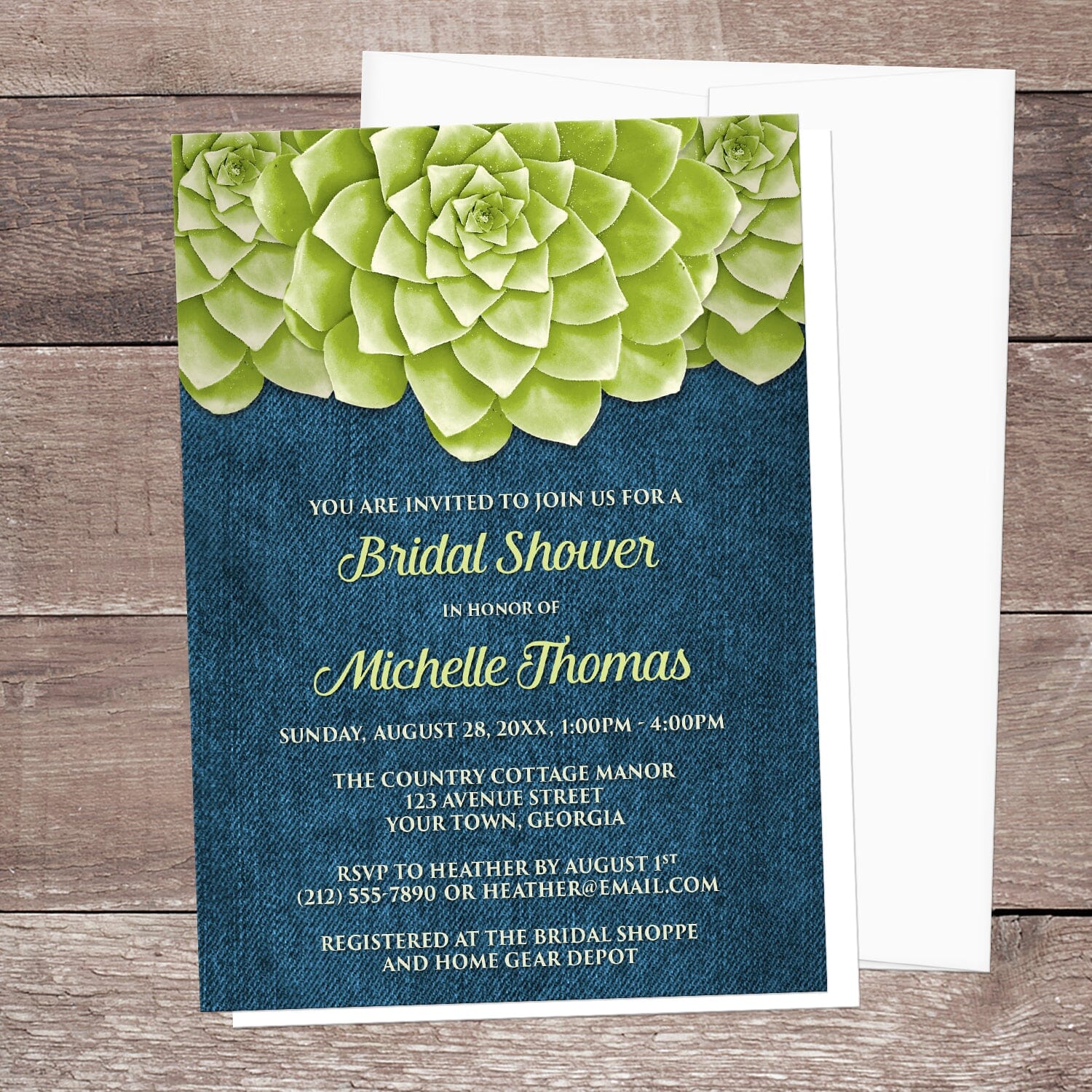 Succulent Green Blue Denim Bridal Shower Invitation shown on a wooden surface with a white envelope.