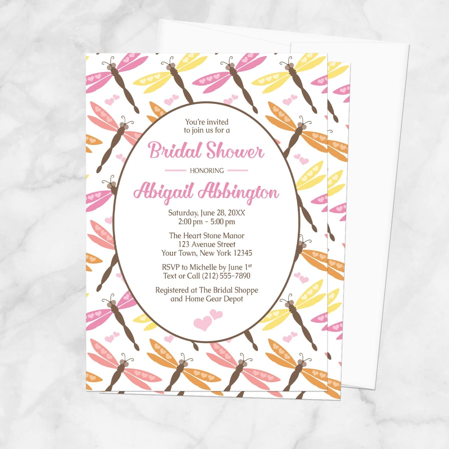 Summer Dragonfly Bridal Shower Invitation shown on a marble surface with a white envelope.